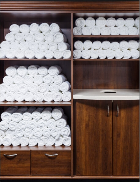 Shelving and cupboards holding spa towels